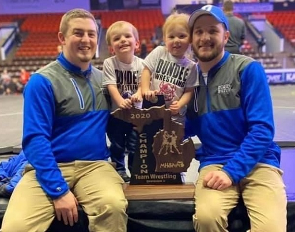 Stevens and son Brady, and Hall and daughter Kimberly, celebrate the 2020 championship.
