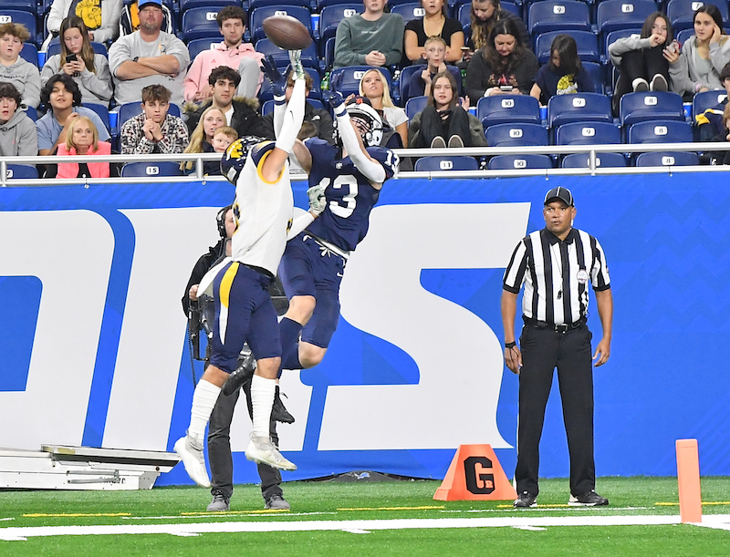 A Martians defender bats away a pass intended for the Sailors’ Carson Vis (13).