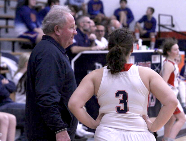 MCC coach Todd Erickson talks things over with Leah Stickney (3). 