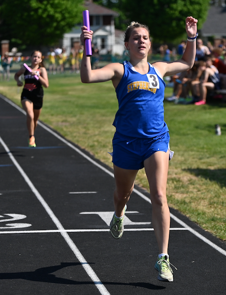 Stephenson's Jada Kuntze crosses the finish line first in the 3,200 relay.