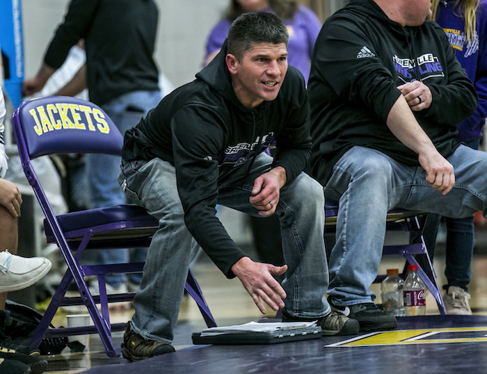 Yellow Jackets coach Brett Peterman guides one of his competitors. 