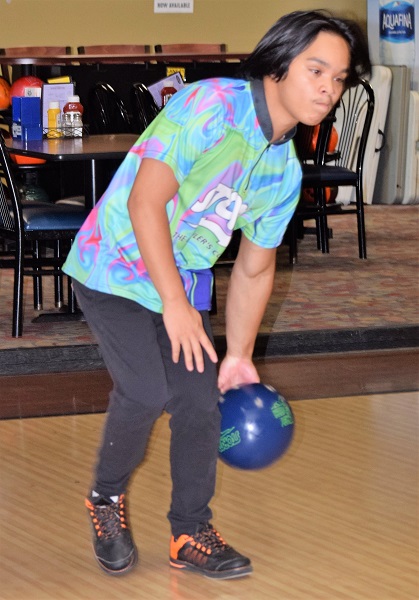 Brent Wood shows his left-handed, left-footed bowling style. 