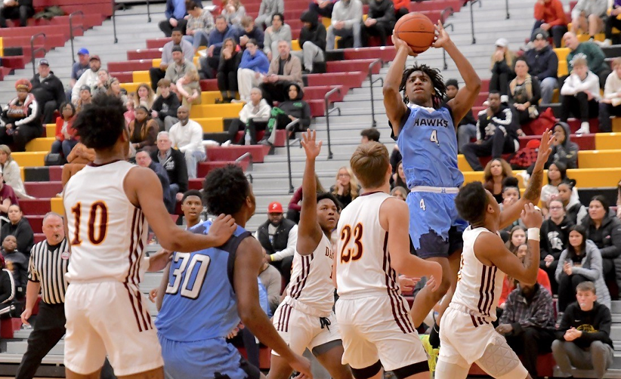 Jakobie Boose (4) elevates for a jumper as Flint Hamady and Davison closed the Cardinal Classic with a five-overtime matchup won by the Cardinals 94-90. 