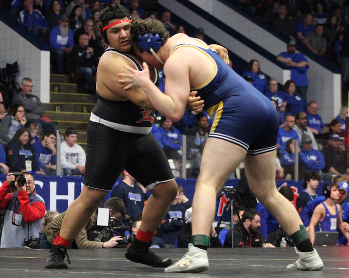Goodrich’s James Mahon, right, works against Lowell’s Juan Acosta for a 2-1 decision at 285. 