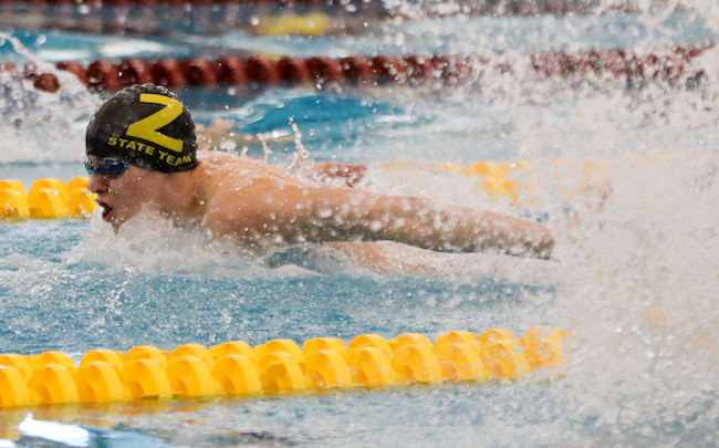 Zeeland’s Owen Stephens swims to a championship Saturday in the 200 individual medley. 