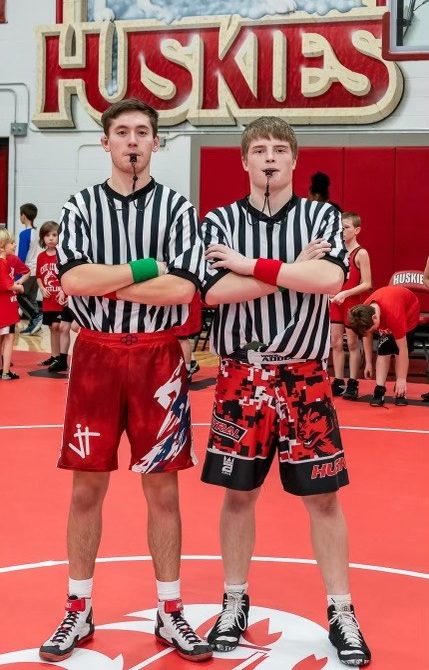 Smith and Noffsinger help as officials at a youth wrestling tournament this week. 