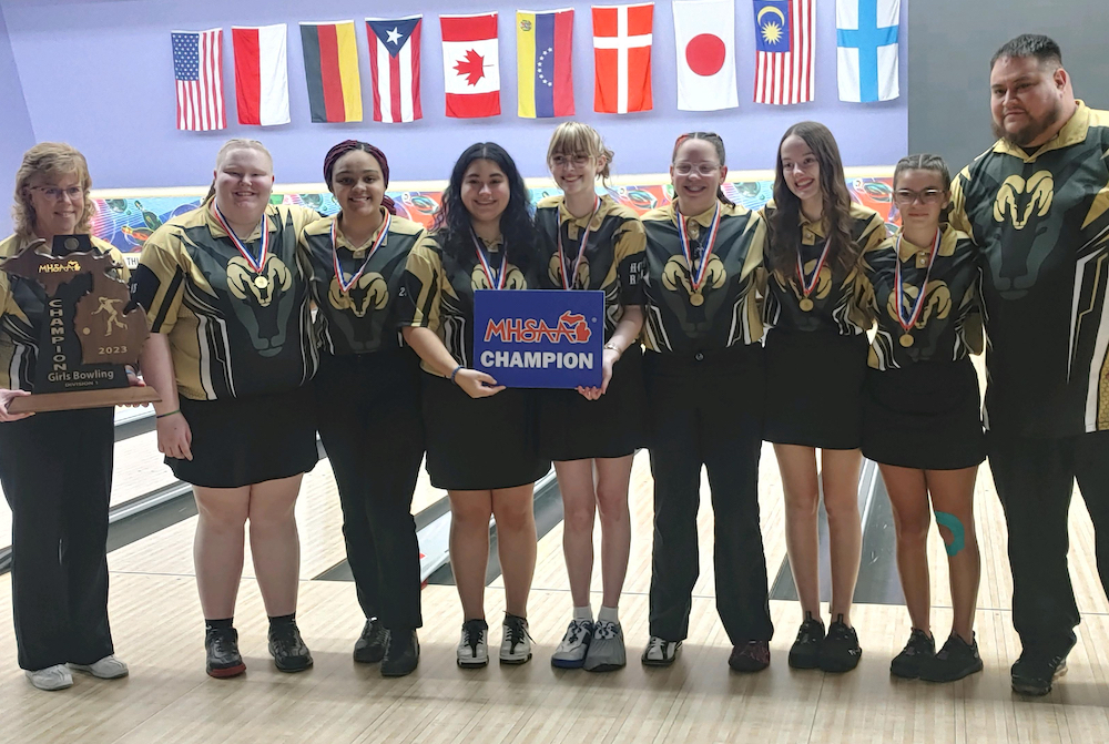 The Holt girls bowling team celebrates its 2023 Division 1 championship.