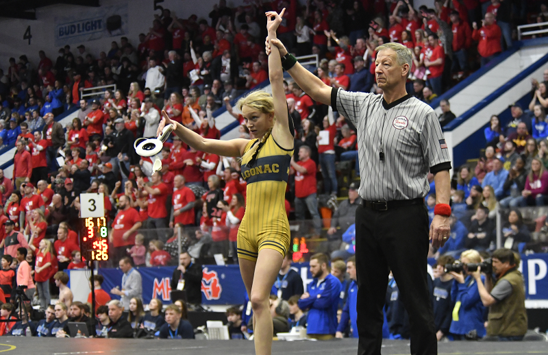 Algonac’s Sky Langewicz has her arm raised in victory after winning a match during her team’s Division 3 Semifinal.