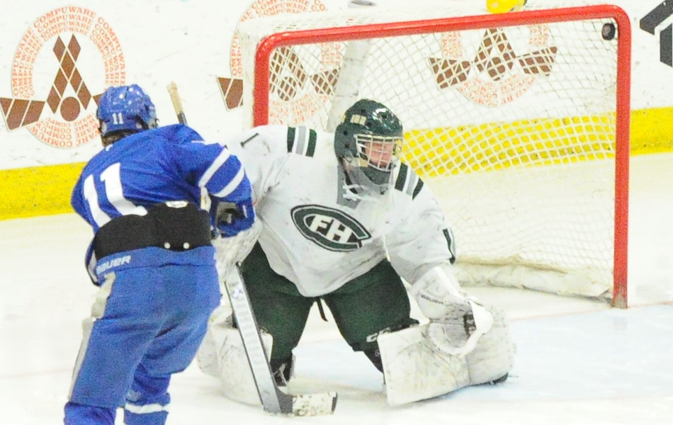 Detroit Catholic Central gets a breakaway goal from John Rocco despite being shorthanded two players on the way to a 2-0 Division 1 win Friday over Grand Rapids Forest Hills Central.