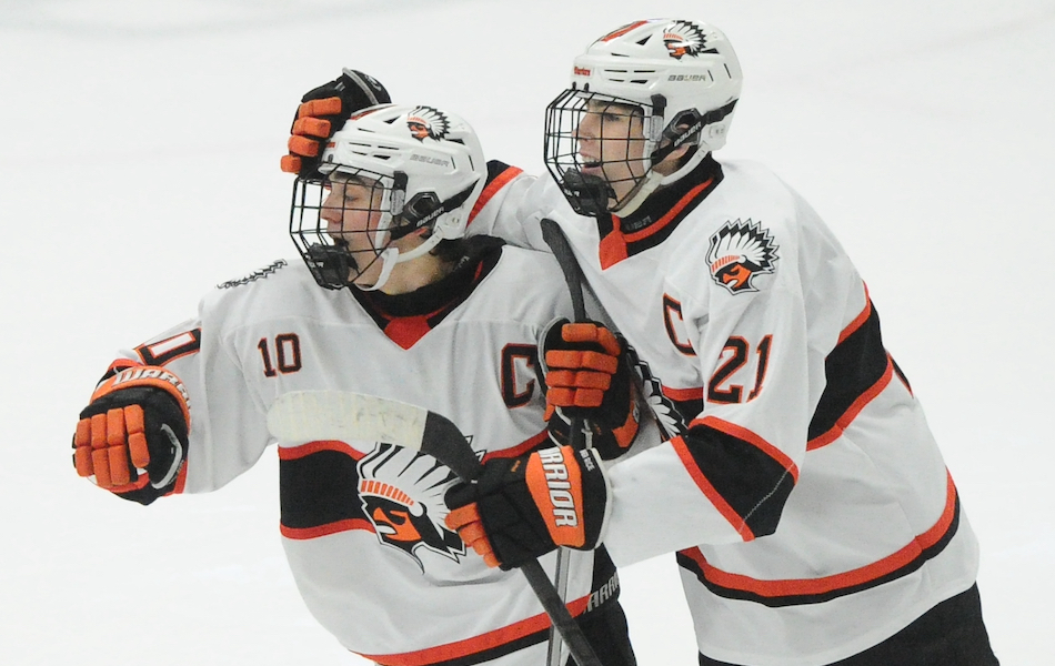 Jack Cassidy (21) and teammate Peter Rosa celebrate Cassidy’s game-ending goal Thursday.