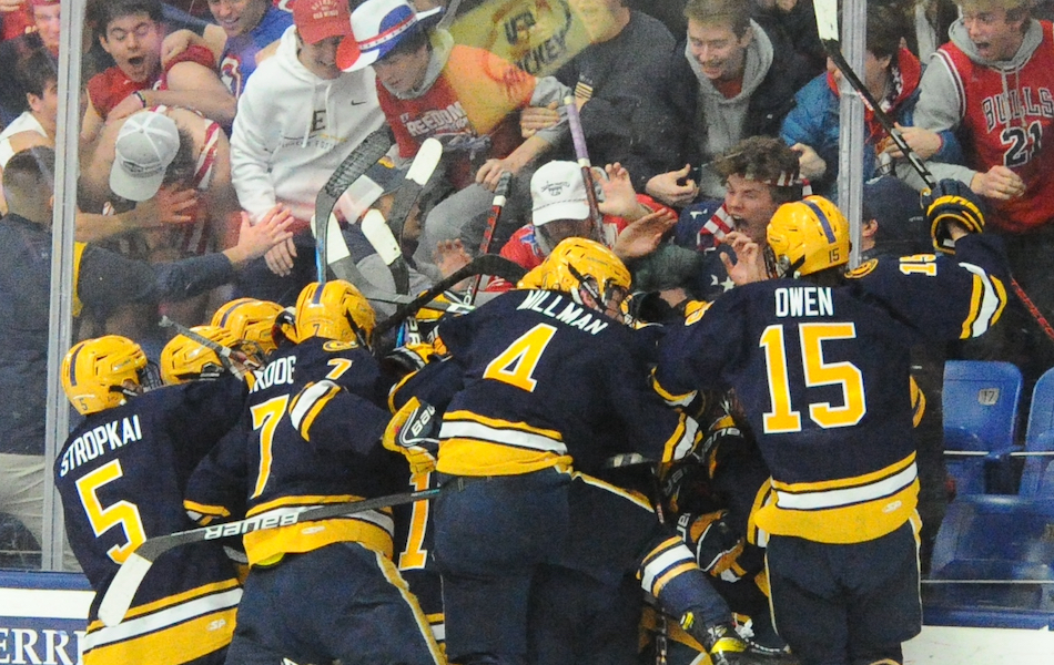 EGR players rush to the glass in front of their fans Friday to celebrate the comeback win.