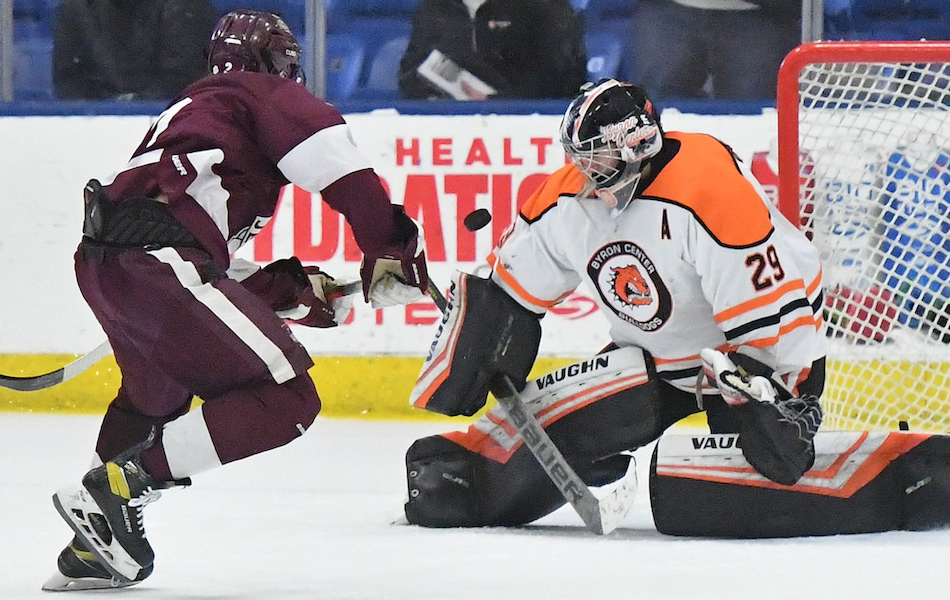 Byron Center goalie Carson MacKenzie turns away a shot during the second period against U-D Jesuit on Thursday.