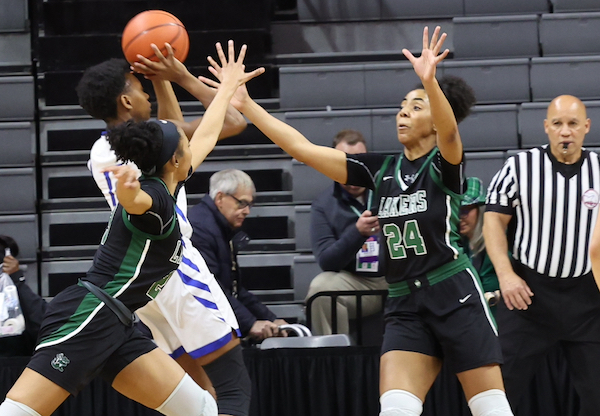 The Lakers' Indya Davis (24) is among those defending as Madison Morson pulls up for a jumper.