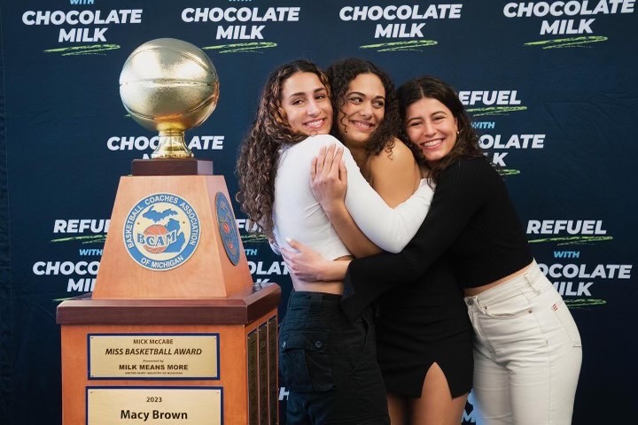 Macy Brown and her sisters celebrate her Miss Basketball Award.