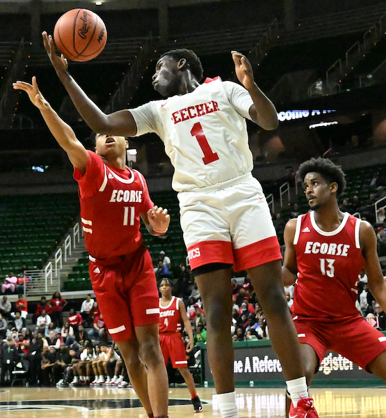 The Bucs’ Kevin Tiggs Jr. (1) pulls in a rebound while Ecorse’s Deontae Jude (11) also grabs for the ball.