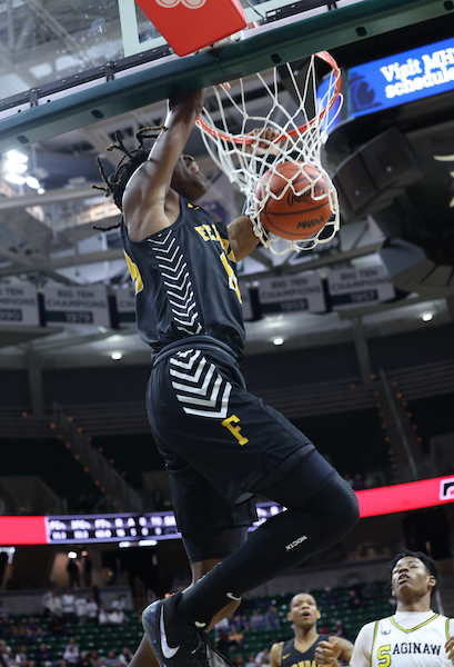 The Eagles’ Christopher Williams dunks during his team’s Semifinal win.