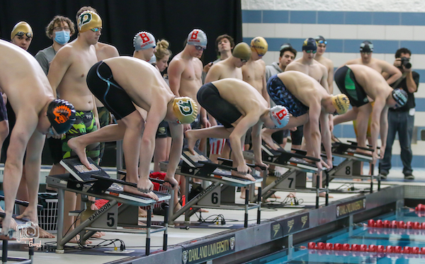 Thomas Bacigalupo, second from left on starting block, prepares to lead off the B heat of the 400 freestyle relay. 