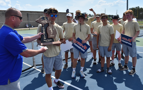 The Miners are presented with the championship trophy Wednesday. 