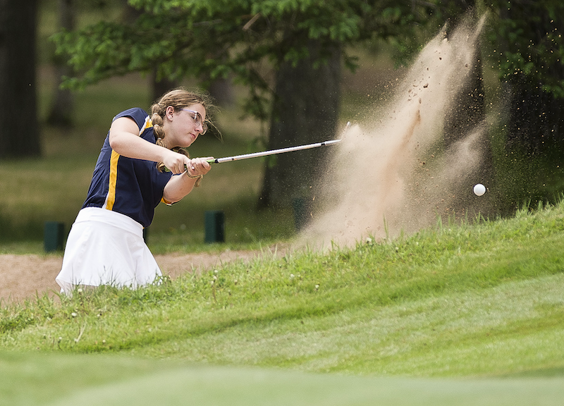 Bark River-Harris’ Ella Boney hits out of the sand during her UPD2 Final round. 