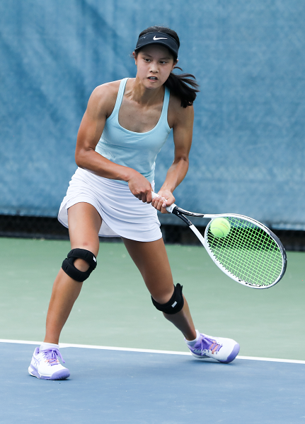 Ann Arbor Skyline’s Sari Woo returns a volley during her No. 1 singles match.