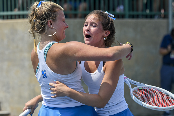 Forest Hills Northern’s Ryan Morey and Paige McKenzie celebrate their championship at No. 1 doubles. 