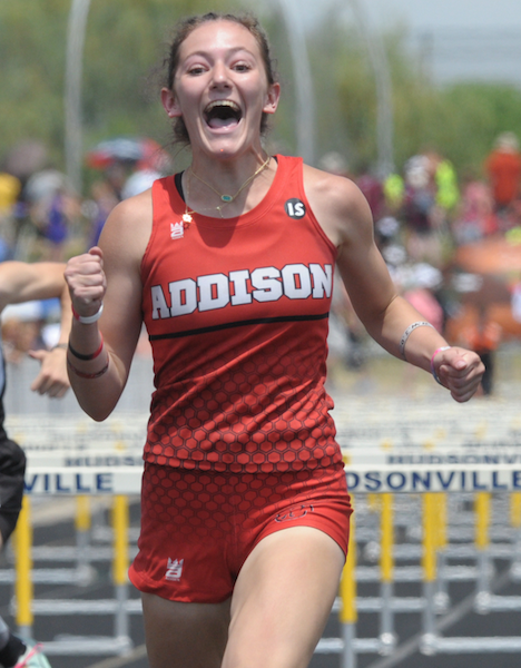 Addison's Molly Brown celebrates her win in the 100 hurdles. 