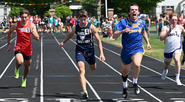 Kingsford's Michael Floriano, second from right, edges Sault Ste. Marie's Carter Oshelski in the 100.