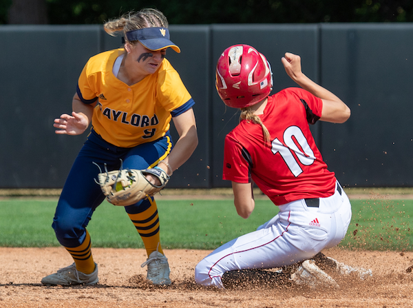Vicksburg's Maddison Diekman (10) slides into second base as Gaylord's Alexis Shepherd looks to make the tag.