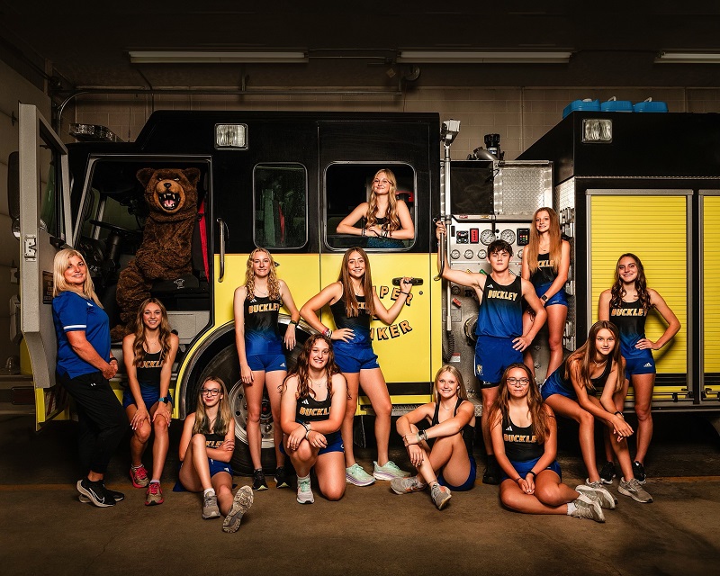 The Bears’ team photo with a fire engine this fall is symbolic of the team’s “We’re on Fire” theme. From left: Coach Jolie King, Aiden Harrand, Natalie Halloway, Kinsey Peer (standing) Allie Brimmer (kneeling), Maddie Chilson (standing), Addisen Harrand (inside fire truck), Kayla Milarch (sitting), Matthew Bentley (standing) Autumn Kelsey (sitting), Kaylee Swanson (on truck), Mikayla Kulawiak (seated leaning forward) and Brooklynn Frazee (standing). 