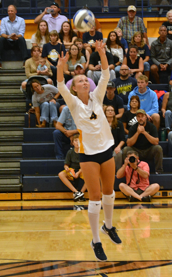 Cassie Jenema sets for a teammate during a match. 