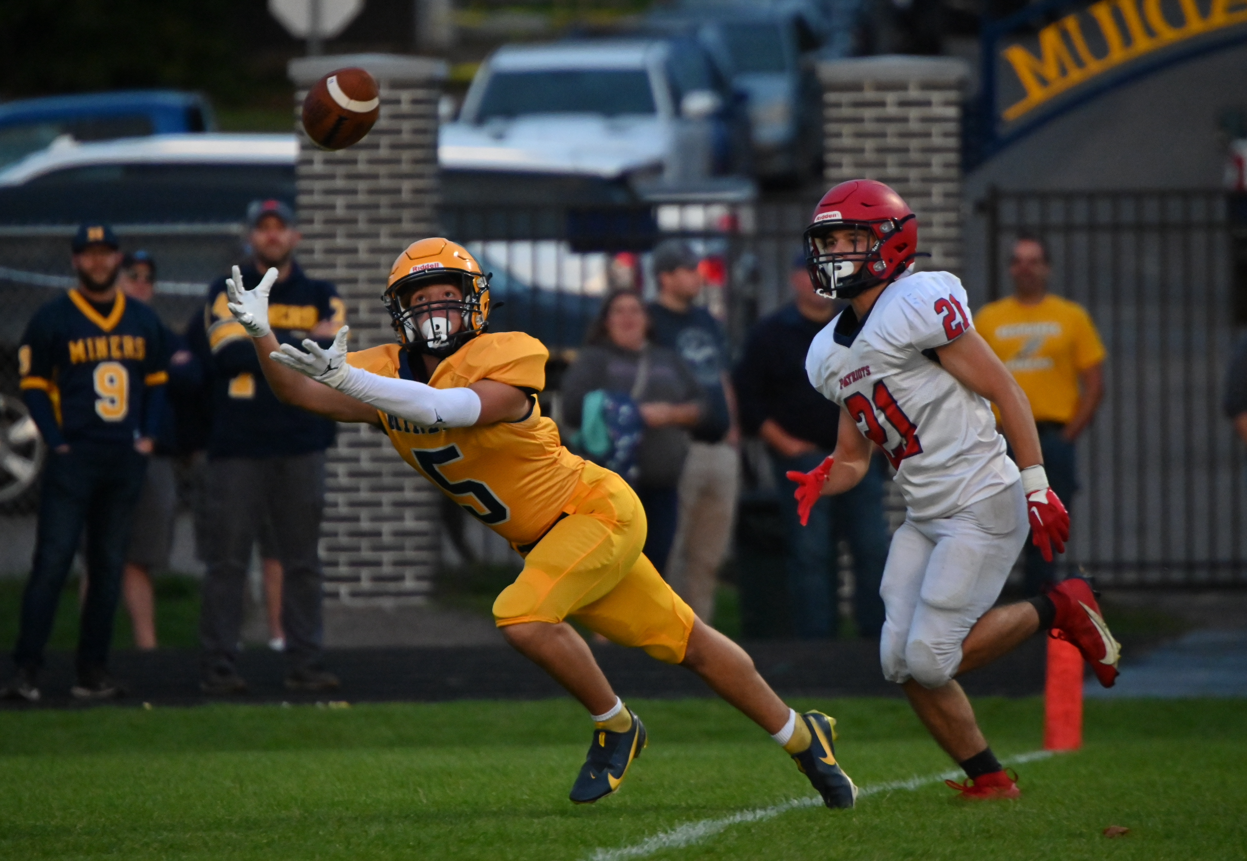 Negaunee's Ian Engstrom (5) tries to catch a pass just a little bit out of his reach.