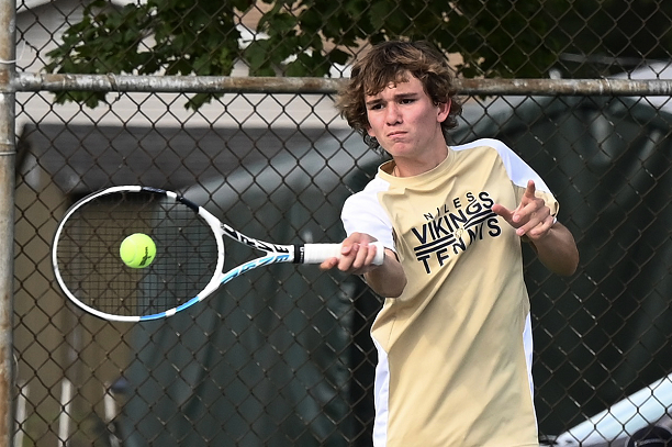 Krueger follows through on a forehand shot during a Wolverine Conference match earlier this season.
