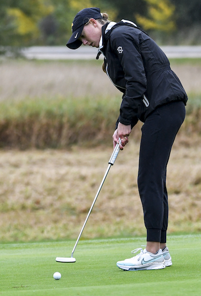 Macomb Lutheran North's Lauren Timpf putts during her run to a third medalist honor.