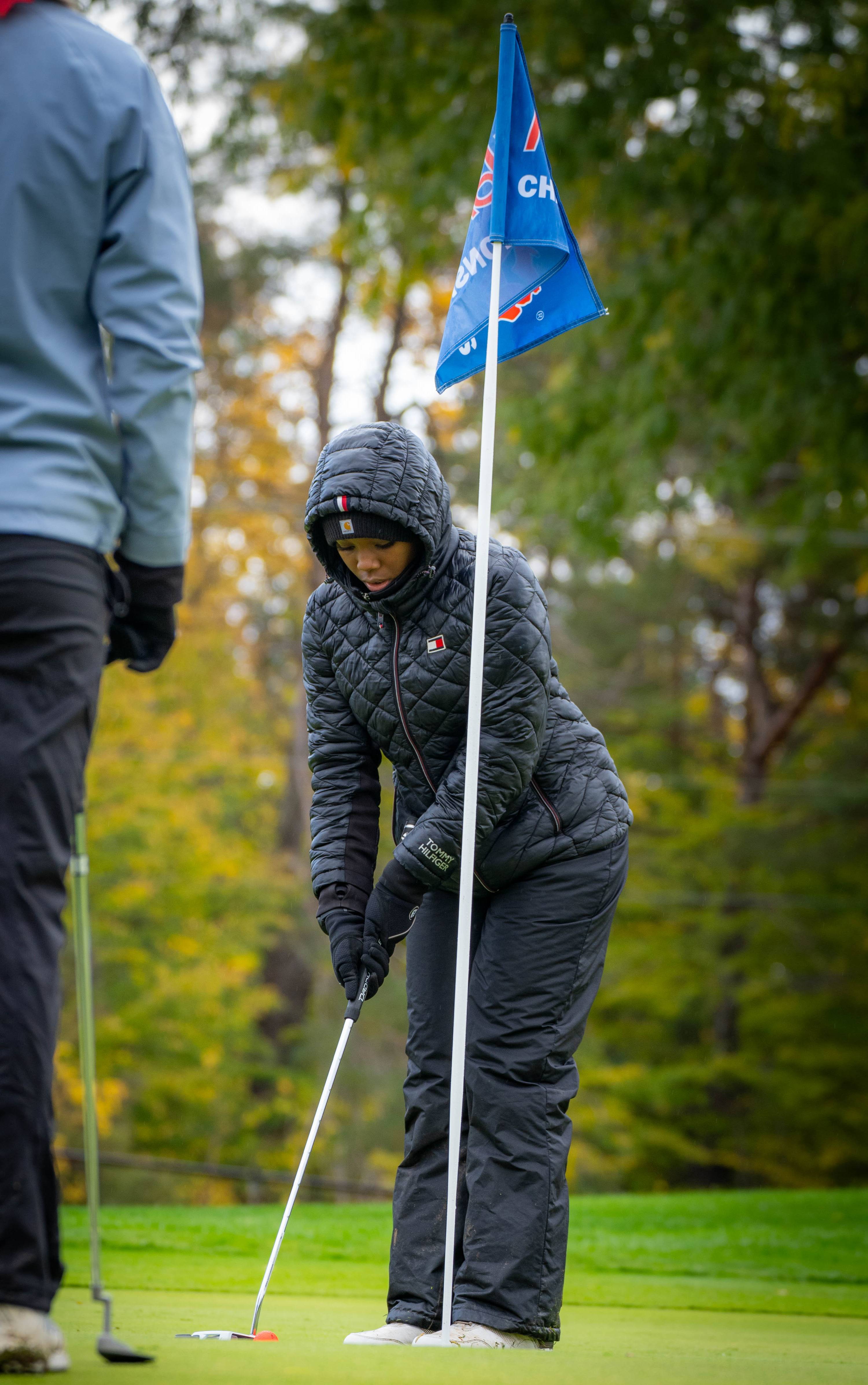The Technicians' Nyla Joseph putts during the Final.