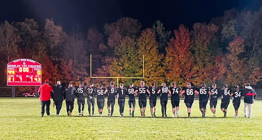  Hart's senior football players and their coaches take a final walk off the field after defeating Ravenna, 44-0, on Oct. 20 in the final regular-season home game. 