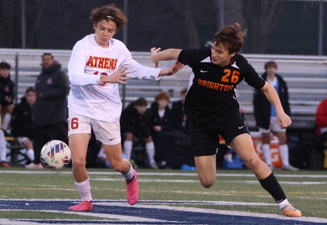 Troy Athens JD Hupman (16) and Brighton’s Devlin McGinnis work to gain possession during Saturday’s Final.