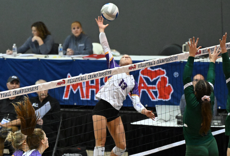 Kalamazoo Christian’s Makenna Ekkens (13) takes a big swing at the net during the No. 4 Comets’ 25-15, 25-10, 25-17 win over top-ranked Monroe St. Mary Catholic Central. 