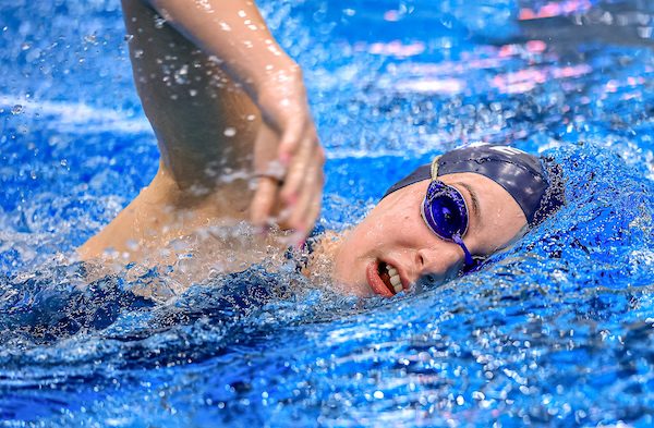 A Saline swimmer competes Saturday.