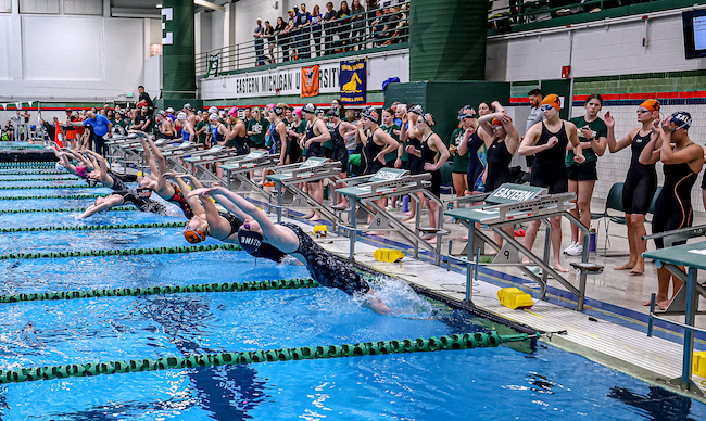 Swimmers launch for the medley relay.