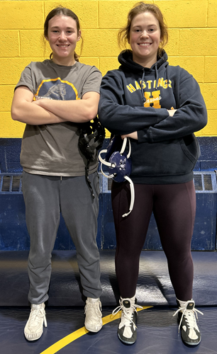 First-year wrestler Skylar Fenstemaker, left, and returning Finals placer Sophia Sunior are two of 16 athletes on the team. 