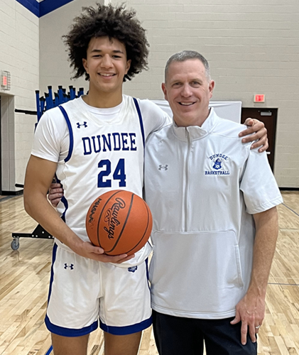 Whitaker, left, with Dundee coach Jay Haselschwerdt. 
