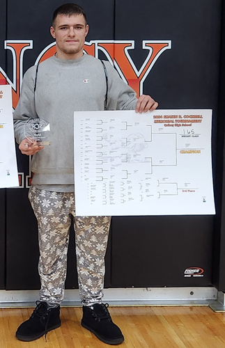 Gavin Schoff, far right, from Niles Brandywine, holds up his bracket after winning the 157-pound weight class at the Shawn Cockrell Invitational at Quincy High School earlier this month.