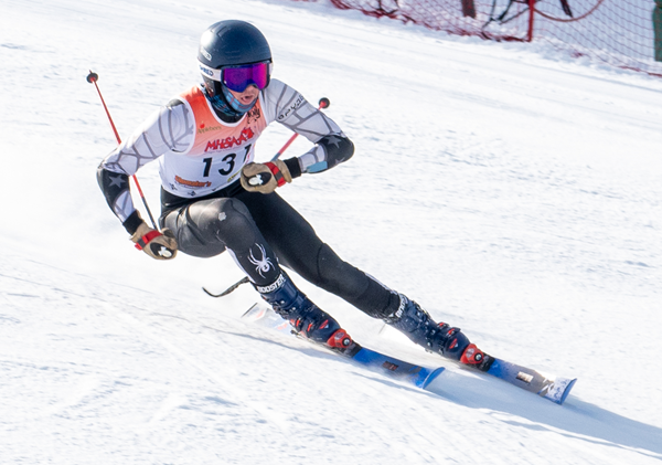 Houghton’s Eli Heathman speeds down the hill on the way to winning the giant slalom.