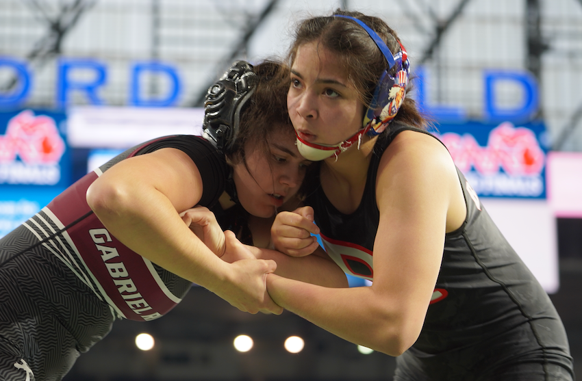 Kaili Manuel, right, works to gain control during her 145-pound championship match against Riverview Gabriel Richard’s Rihanna Venegas.