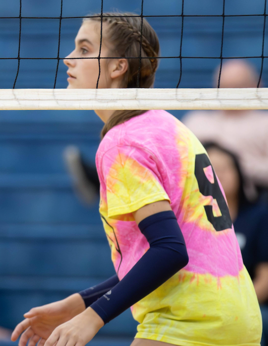Dykstra stands at the net during volleyball season.