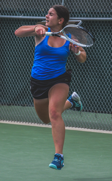 Utica Eisenhower's Gabriella Sadowski returns a volley during her No. 1 singles championship win. 