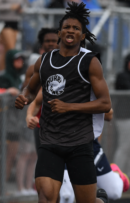 Detroit Douglass’ Anthony Buford finishes his win in the 400.
