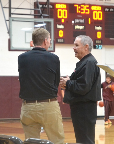 Allen talks casually with McBain Northern Michigan Christian boys assistant coach Terry Pluger prior to the start of the varsity game with Buckley on Dec. 8.&nbsp;