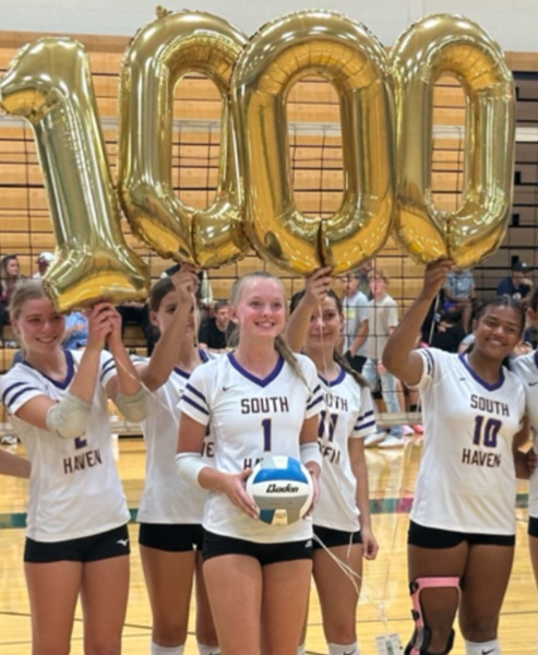 Knox is celebrated by her teammates after reaching 1,000 career kills Saturday.