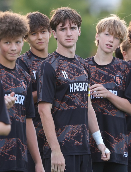 Juneau stands among his teammates during a game.